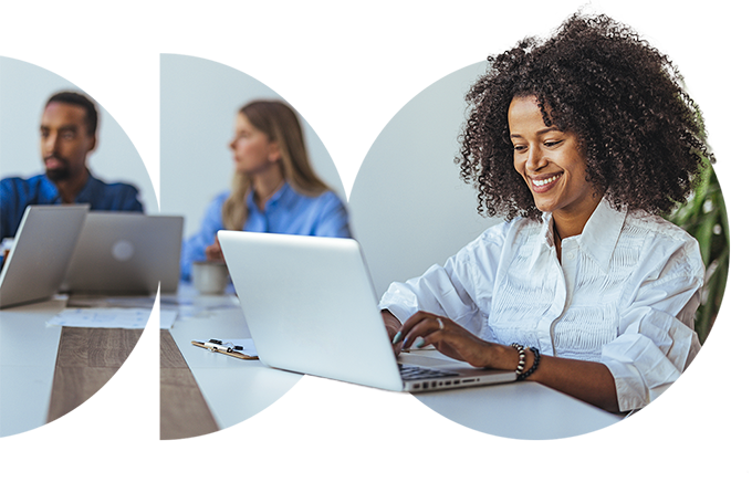 Smiling woman working on laptop