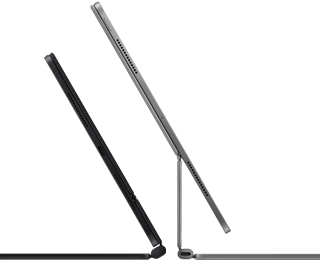 2 iPad Pro devices attached to Magic Keyboard, side exterior, thin profile, space black colour with speakers and USB-C port, tilted half open, silver colour, open, tilted back showing the keyboard’s floating cantilever design, speakers and microphone