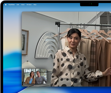 A video call on a MacBook Pro where a woman shows fabrics to two people on the call, with Centre Stage keeping her centred in the frame as she moves around