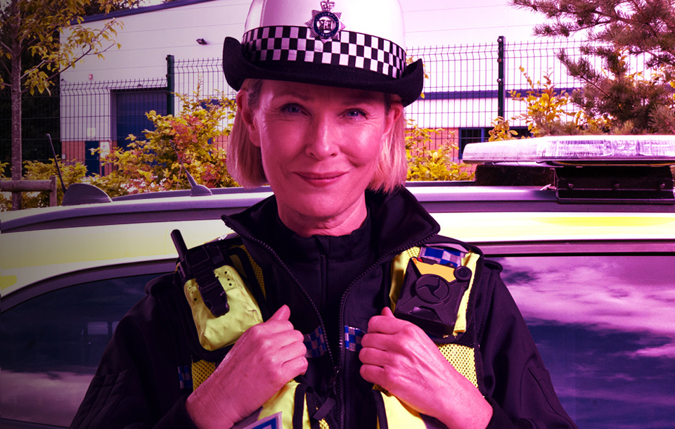 Police officer in front of car Police officer in front of car