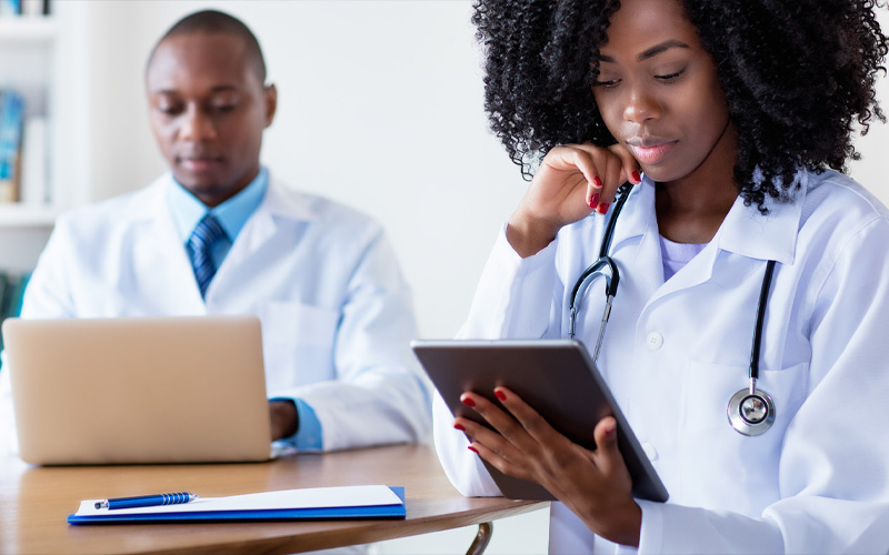 Doctors with tablets