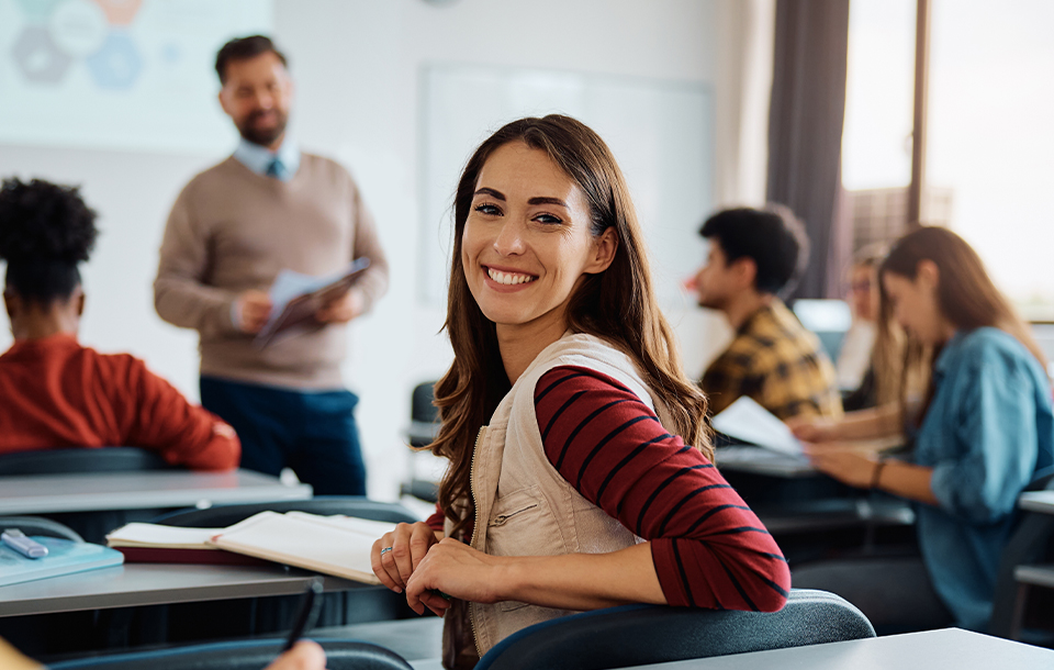 Student smiling in class Student smiling in class
