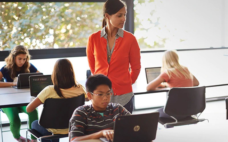 Technology specific to your industry teach observing a class using laptop devices