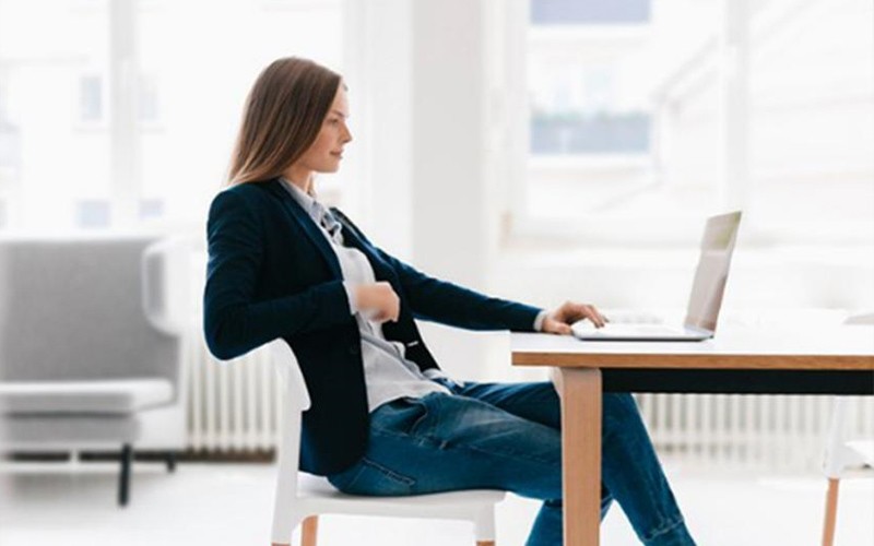 Device built for business Woman working on an Intel powered laptop