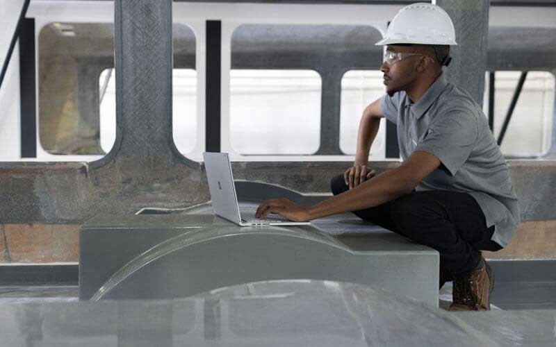 Microsoft technology industry solutions Engineer working on Microsoft Surface in the field