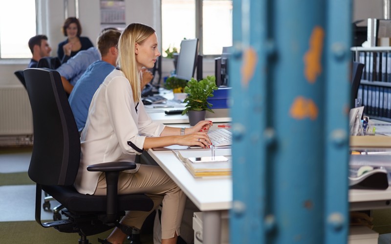 Use hundreds of modules that seamlessly integrate with other Red Hat products Businesswoman working in modern startup office