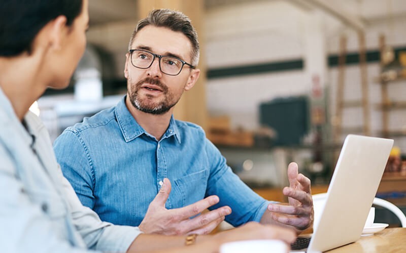 Tower enterprise-grade automation is available in three editions Businessman explaining new strategy to colleague